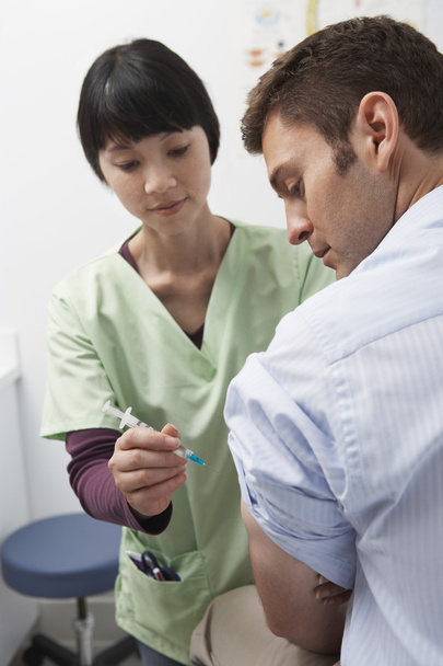 Doctor Injecting Patient - Photo, Image