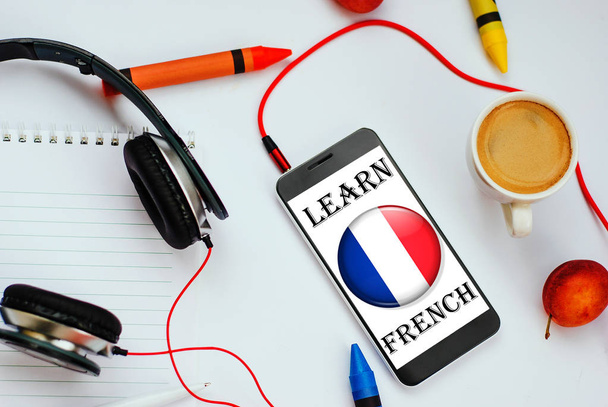 smartphone with french flag and headphones. concept of french learning through audio courses - Photo, Image