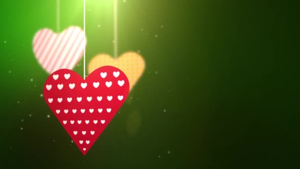 papír Valentin szív leesett, lógott a string a zöld háttér - Felvétel, videó