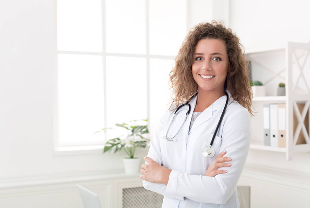 Confident physician standing in office, copy space - Foto, Imagen