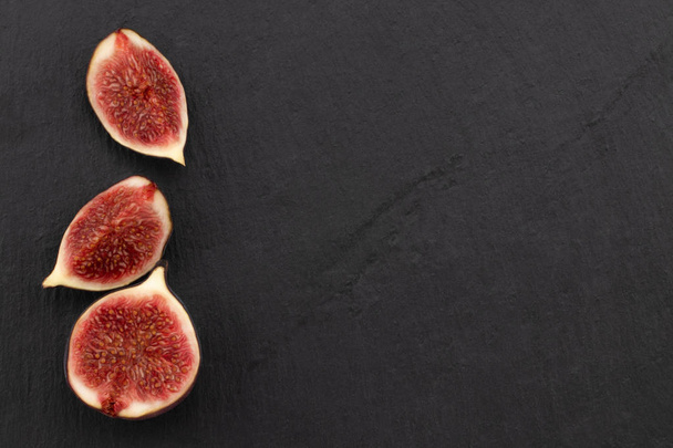 fresh ripe figs on dark background, top view with copy space. - Photo, Image