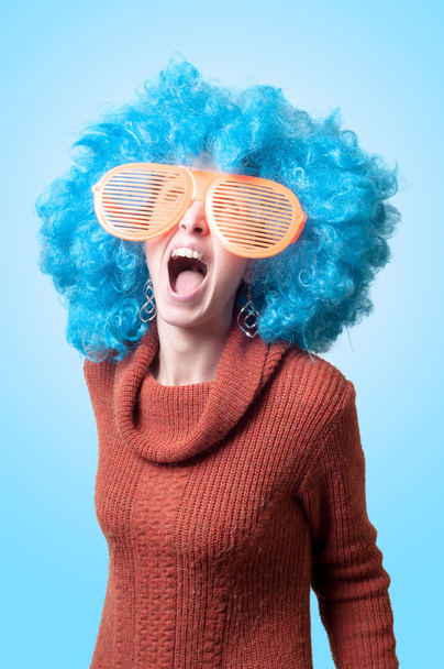 funny girl with blue wig and big blue eyeglasses - Fotoğraf, Görsel