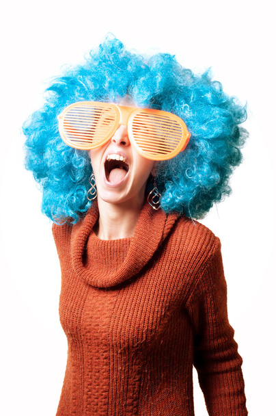 funny girl with blue wig and big white eyeglasses - Foto, Imagen