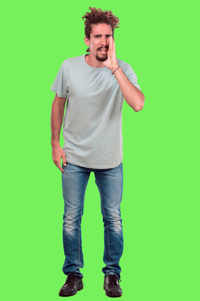 Young bearded man full body gesturing against chroma key green background. Ready to cut out. - Fotografie, Obrázek