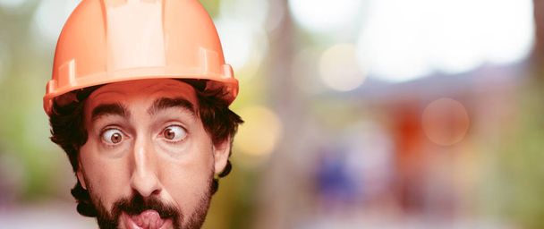 young crazy bearded man cutout head expression isolated. Built worker role. Joking concept. - 写真・画像