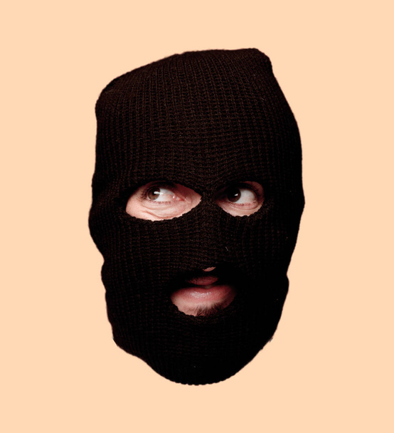 young crazy bearded man cutout head expression isolated. Criminal with ski mask role. Thinking concept. - Foto, imagen