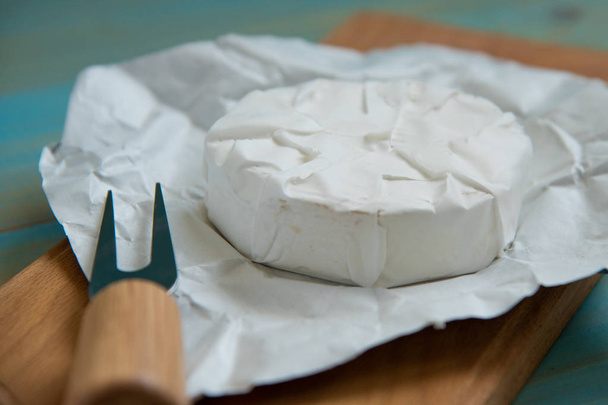 cheese brie or camembert, with a fork - Foto, immagini