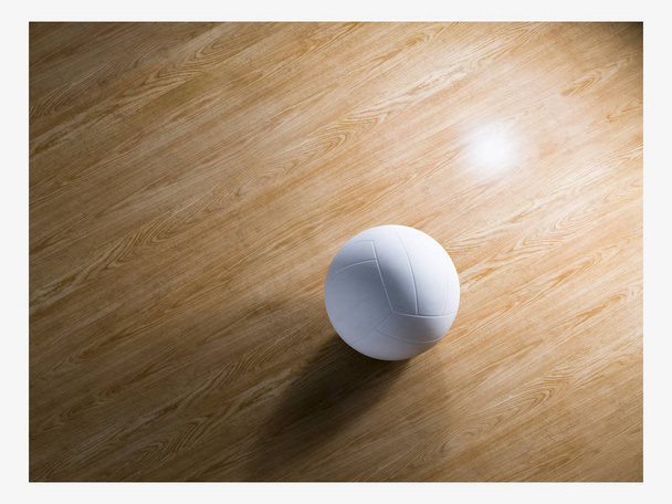 Concepto de deporte, fitness, juego, equipamiento deportivo y objetos: primer plano de la pelota de voleibol en el suelo de madera desde la parte superior, aislado, copia Espacio
 - Foto, imagen