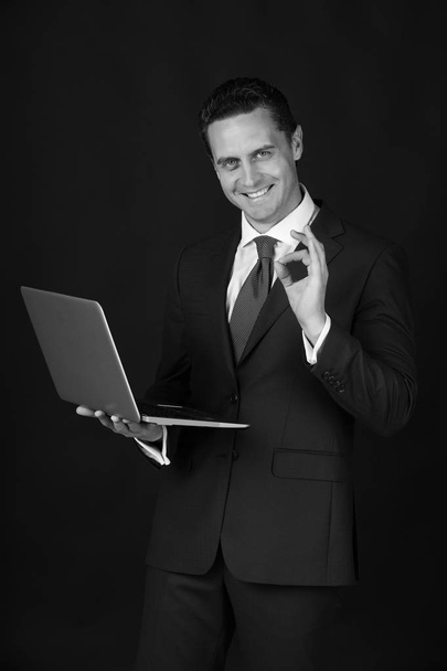 young happy business man with ok gesture and laptop - Фото, зображення