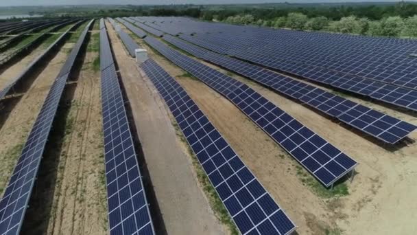 Alternative energy, view of solar panels in field from height - Filmati, video