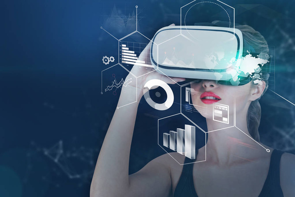 Young woman in vr glasses looking at infographics interface over dark blue background. Toned image double exposure mock up. Elements of this image furnished by NASA - Foto, Bild