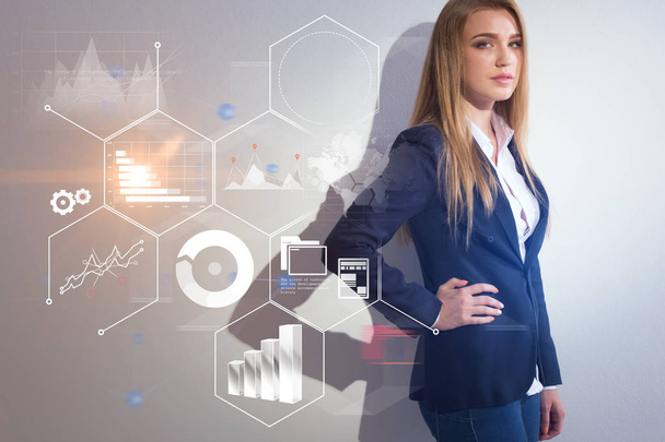 Businesswoman in blue suit standing near white wall. Infographics interface foreground. Toned image double exposure. Elements of this image furnished by NASA - Photo, Image