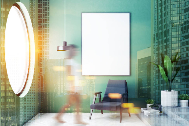Woman walking in modern bathroom interior with green walls, concrete floor, and black armchair with vertical mock up poster hanging above it. Round window. Toned image double exposure blurred - Фото, изображение