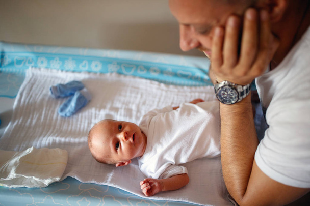 Fatherly love  Newborn boy and his happy father's  - Fotoğraf, Görsel