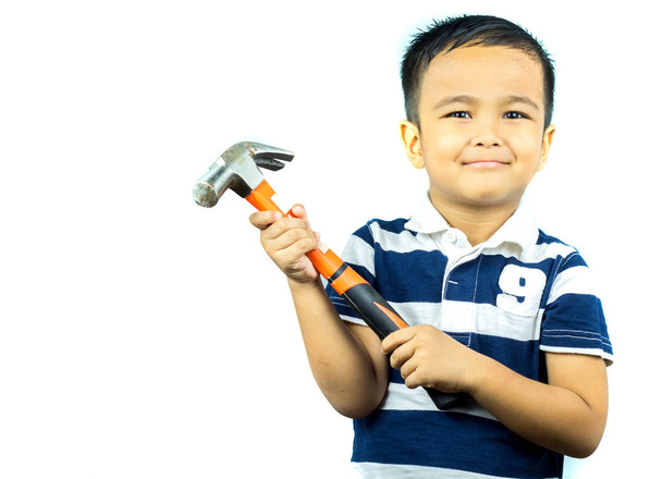 asian boy  holding hammer and smiling on white background - Fotoğraf, Görsel