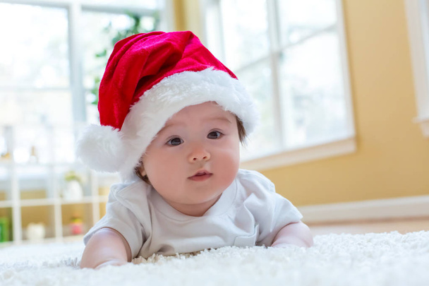 Baby boy with a Santa hat on Christmas - Foto, Imagen