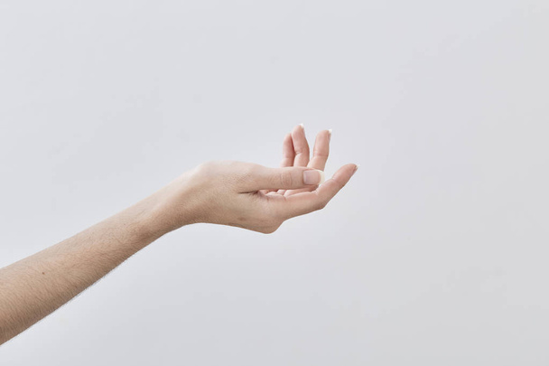 Empty Female hand holding isolated on white background - Photo, image