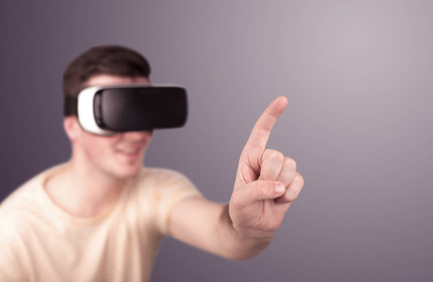 Man wearing virtual reality goggles - Fotoğraf, Görsel