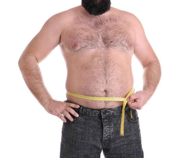 Fat man with measuring tape on white background, closeup. Weight loss - Valokuva, kuva