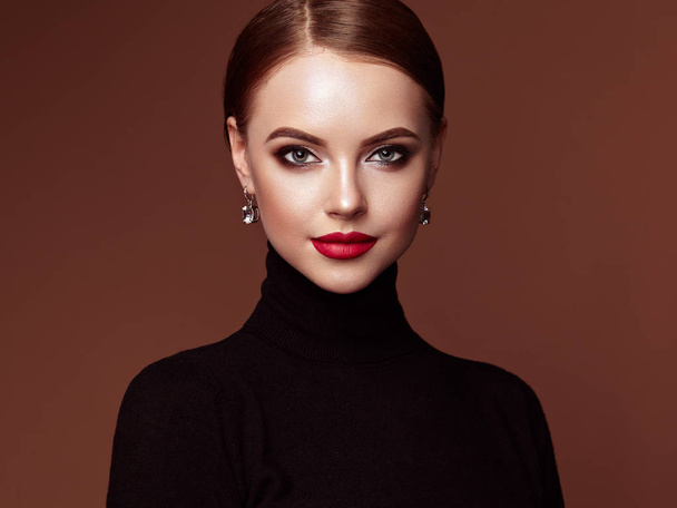 Beautiful Young Woman with Clean Fresh Skin. Perfect Makeup. Beauty Fashion. Red Lips. Cosmetic Eyeshadow. Smooth Hair. Girl in Black Turtleneck - Fotoğraf, Görsel