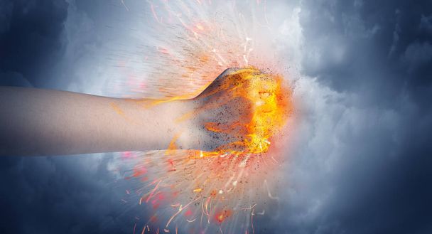Hand hits intense and makes fire - Fotografie, Obrázek