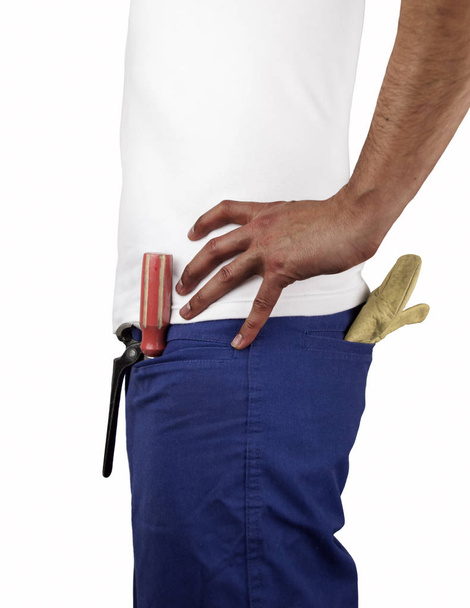 profile of building worker with tools in the pockets and hands on the hip over white background - Fotografie, Obrázek