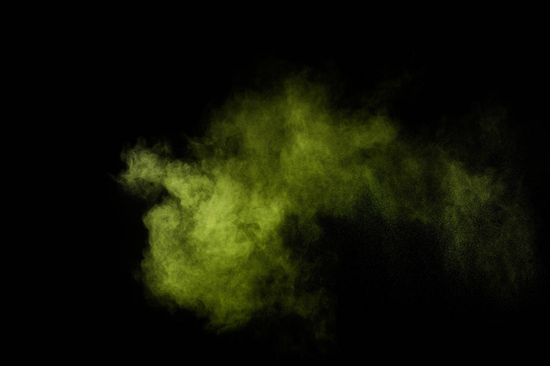 Light green powder explosion on black background. Colored powder cloud. Colorful dust explode. Paint  Holi. - Foto, Imagen