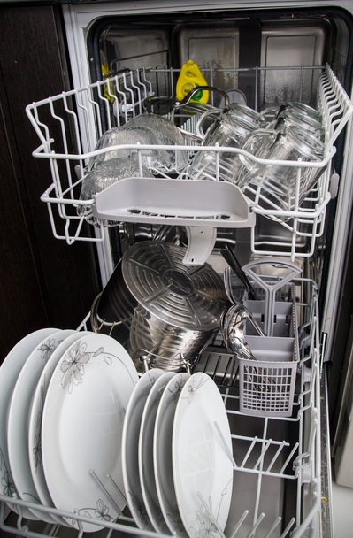Dishwasher with white plates and glasses - Фото, зображення