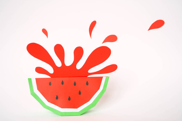 splash from watermelon cut from paper on white background - Foto, imagen
