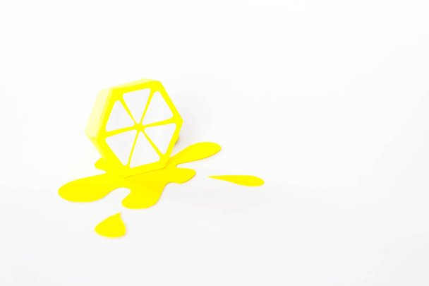 splash from lemon cut from paper on white background - Φωτογραφία, εικόνα