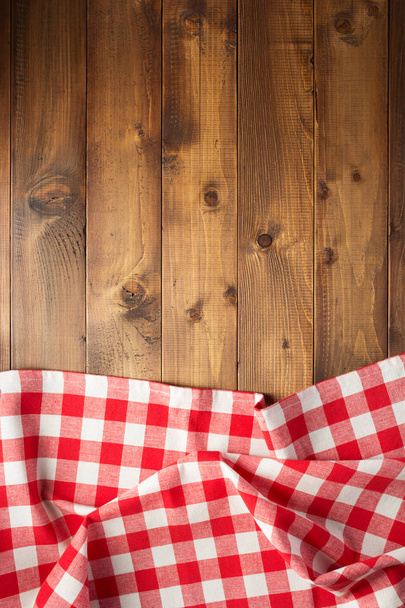 checked table cloth at wooden  surface background, top view - Fotoğraf, Görsel