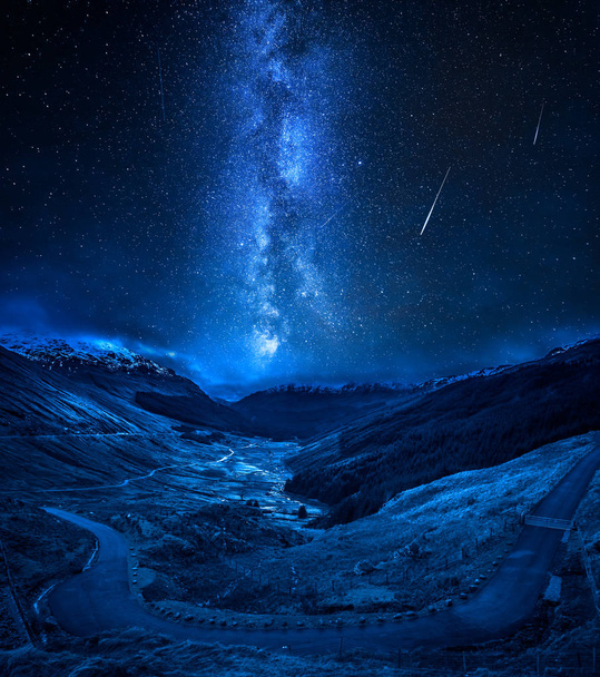 Winding mountain road over a canyon with falling stars - Fotó, kép