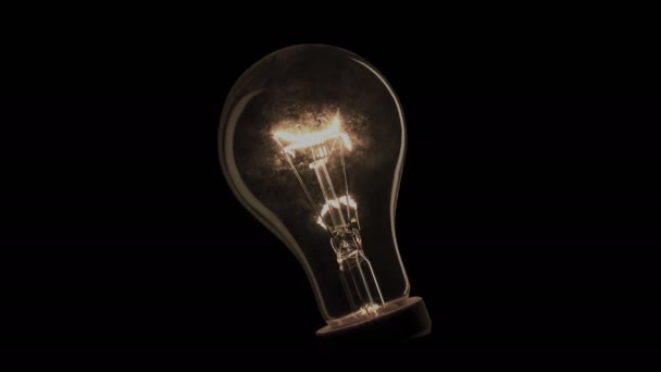Realistic light bulb shaking and blinking on black background. - Footage, Video