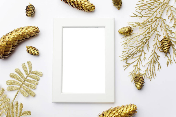 Christmas composition. Frame made of golden christmas decoration Flat lay, top view - 写真・画像