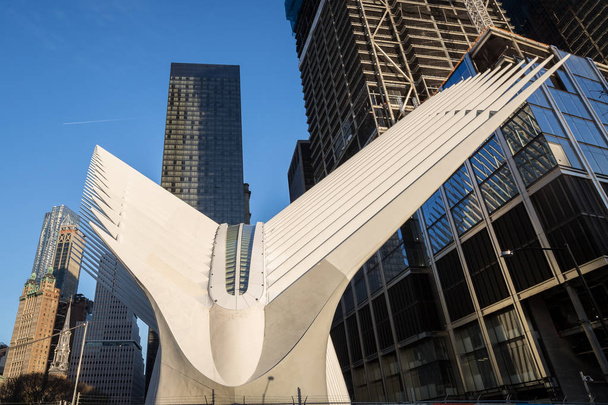 New York, USA, April 10, 2016. Outdoor view of World Trade Center Transportation Hub or Oculus designed by Santiago Calatrava architect in Financial District - Foto, Imagen