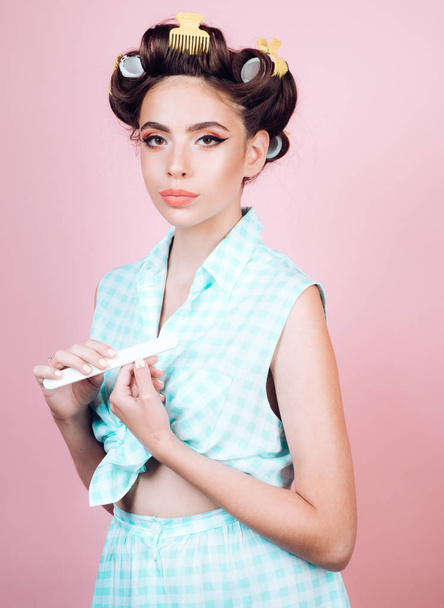 retro woman with fashion makeup and hair. beauty salon and hairdresser. Pin up girl. happy girl grooming in morning. vintage housewife woman make manicure. Fashion and beauty. In her own style - 写真・画像