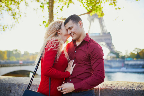 Romantic couple in love near the Eiffel tower in Paris, France - Φωτογραφία, εικόνα