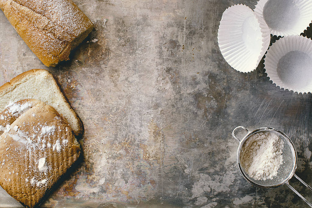 Bakery concept. Breads and pastry material on a gray metal tray. - Valokuva, kuva