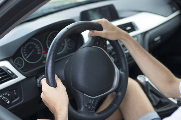 closeup of driver's hands on car steering wheel - Foto, imagen