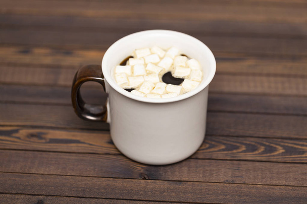 Cup of cocoa with marshmallows on wooden background - Photo, image