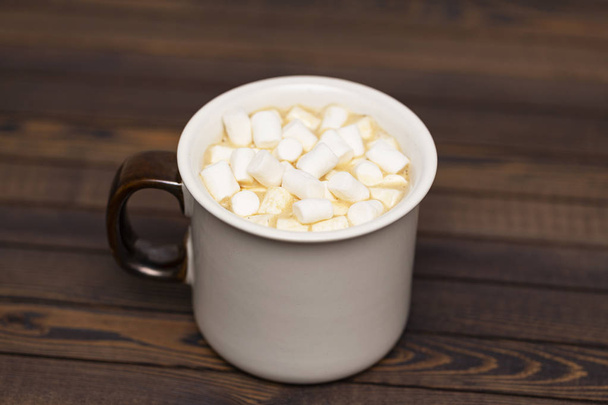 Cup of cocoa with marshmallows on wooden background - Zdjęcie, obraz