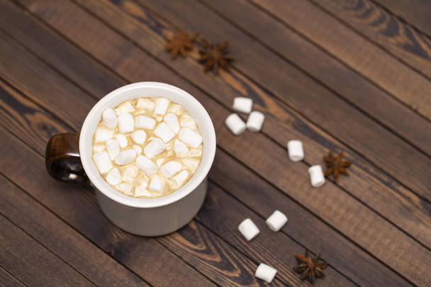 Cup of cocoa with marshmallows on wooden background - Photo, image