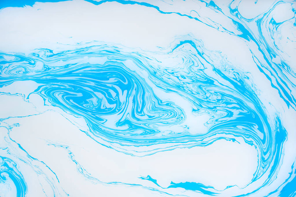 Abstract blue marble background. Stains of paint on the water. - Fotó, kép