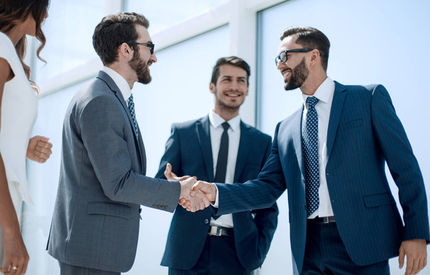 handshake business people standing in the office. - Φωτογραφία, εικόνα