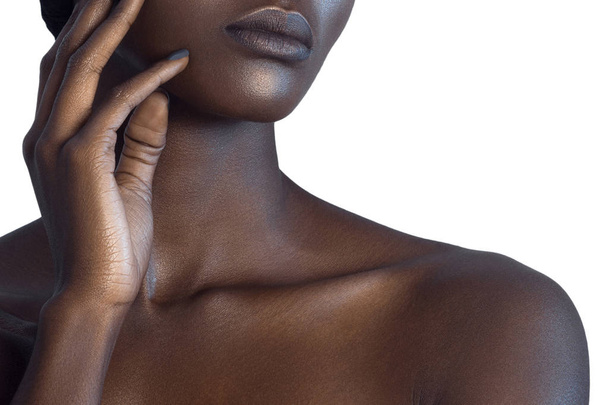 Palm and lips of young beautiful black woman with clean perfect skin close-up. Skin care and beauty concept - Foto, immagini