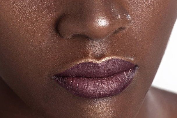 Lips of young beautiful black woman with clean perfect skin. Beauty, cosmetics and makeup - Foto, Imagem