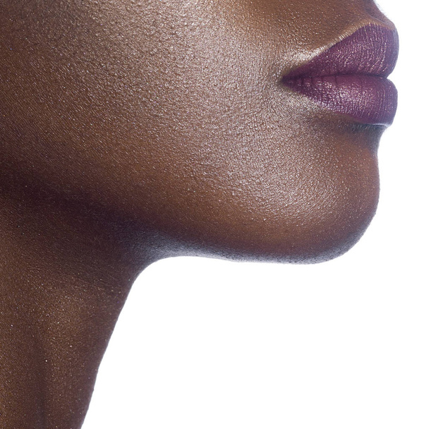 Lips of young beautiful black woman with clean perfect skin. Beauty, cosmetics and makeup - Fotoğraf, Görsel