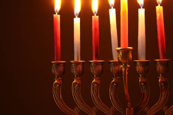 image of jewish holiday Hanukkah background with menorah (traditional candelabra) and candles - Fotografie, Obrázek