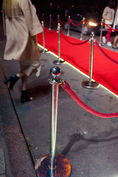 Long red carpet between rope barriers on entrance. - Photo, Image