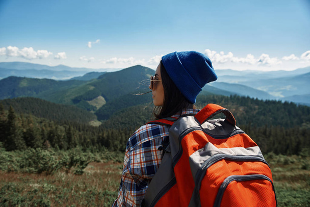 Calm female backpacker is spending time in mountains - Fotografie, Obrázek